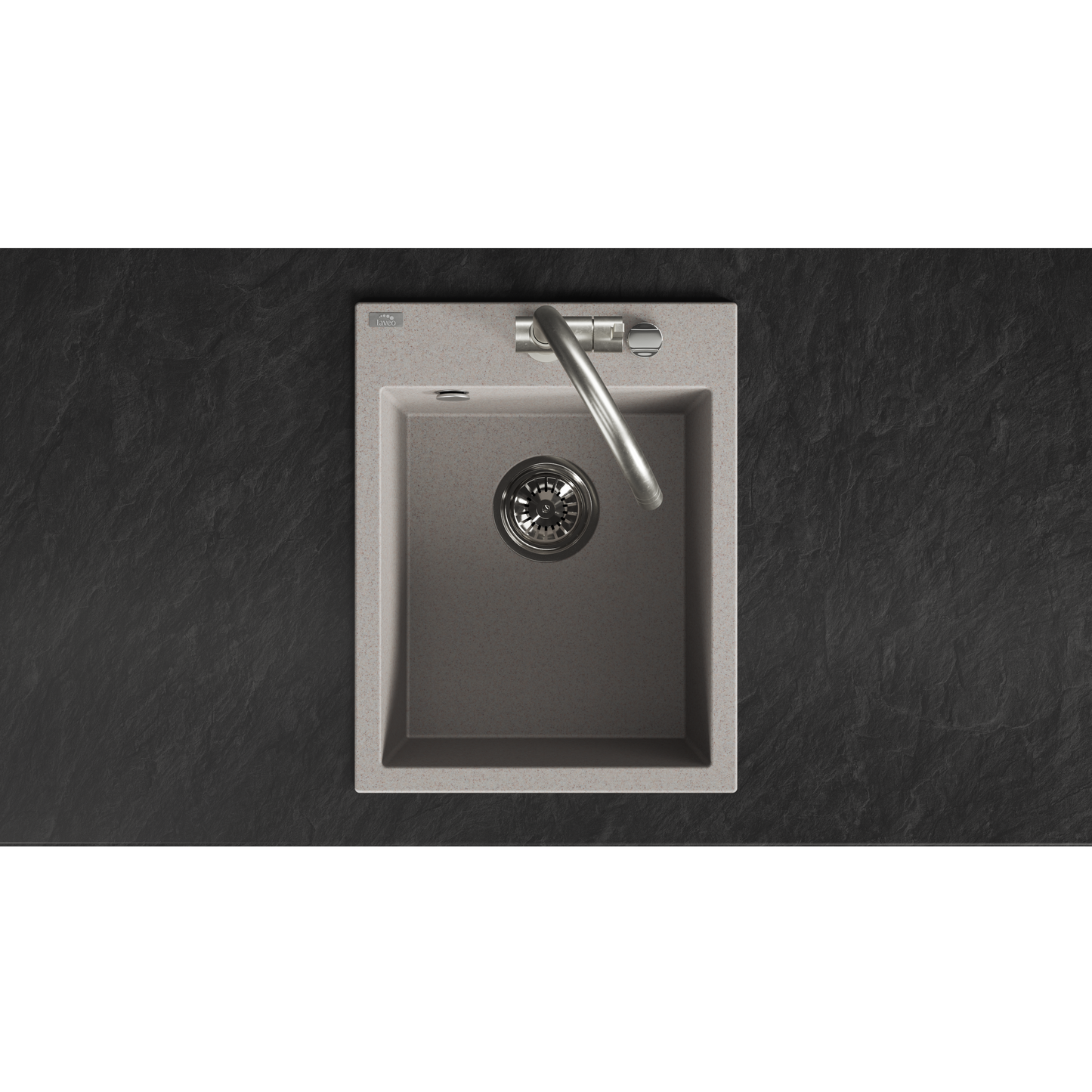 A top-down view of a modern single-basin kitchen sink with a brushed metallic interior, a matching curved faucet, and a light stone or concrete outer rim, set against a dark textured countertop.