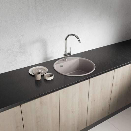 Laveo Muna round single-bowl sink - angled kitchen lifestyle showing the beige finish